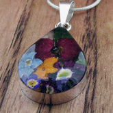 Small silver teardrop pendant with real pressed flowers
